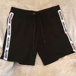 HOLLISTER black shorts with white logo on sides.  Size XL.   Gently worn.